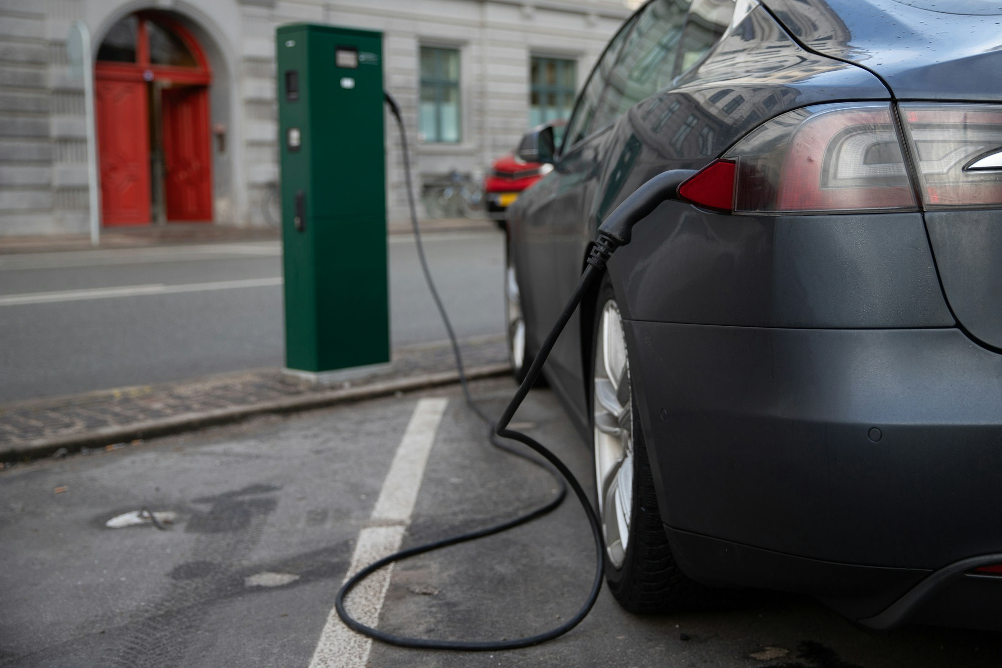 Close-up of the back of an electric car being charged