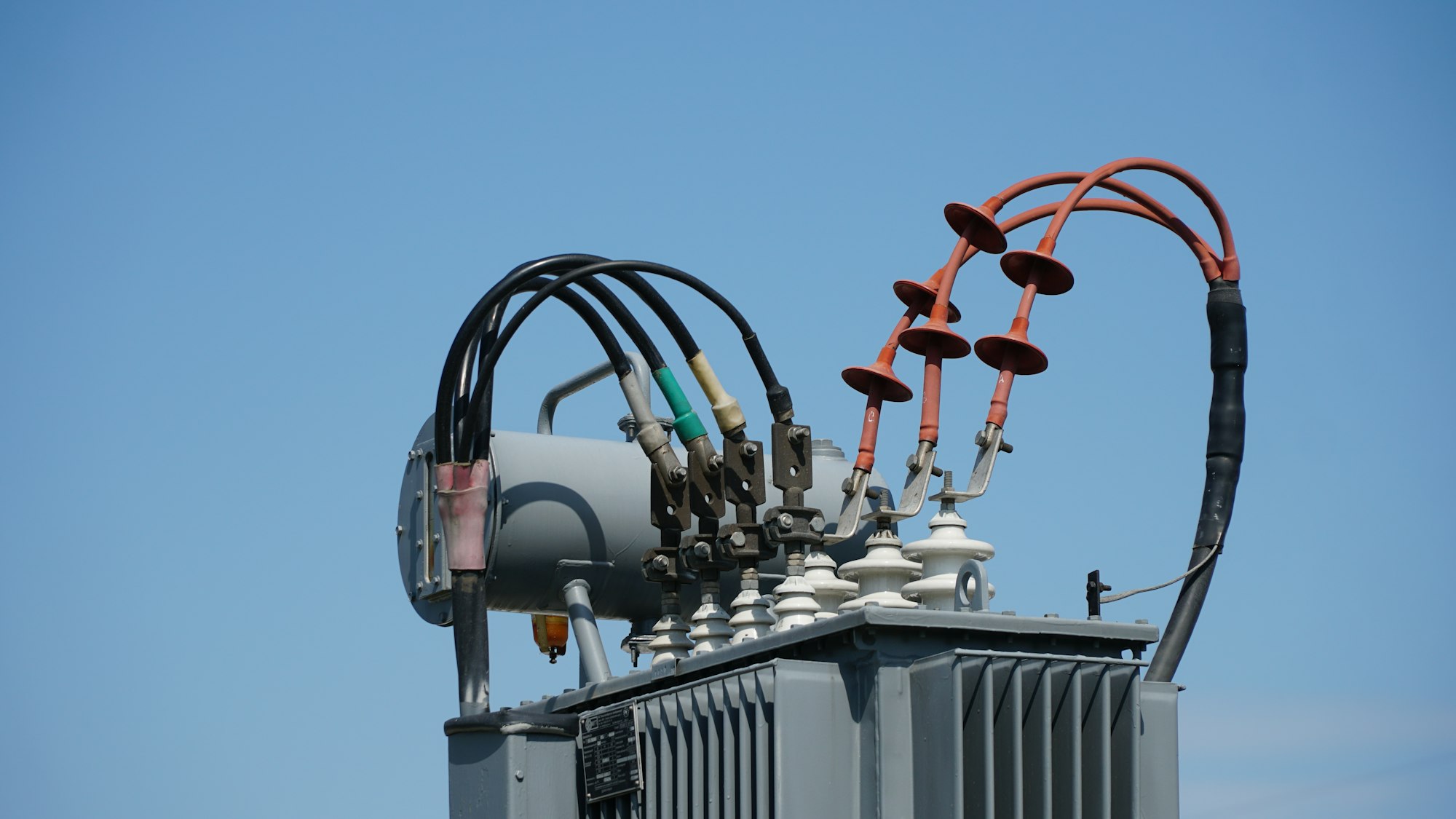 High and low voltage transformer bushings with electrical insulation and electrical equipment at a