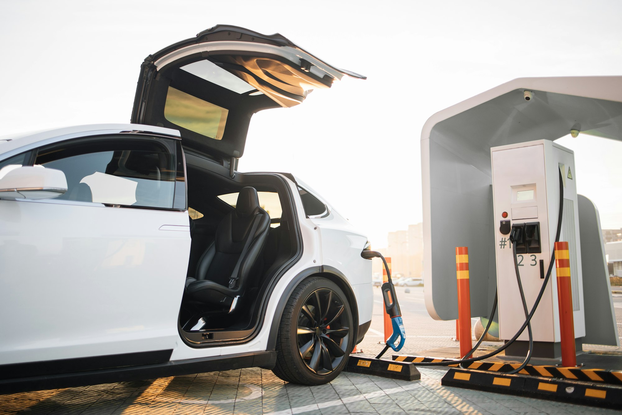 Modern electric car charging at outdoors EV station
