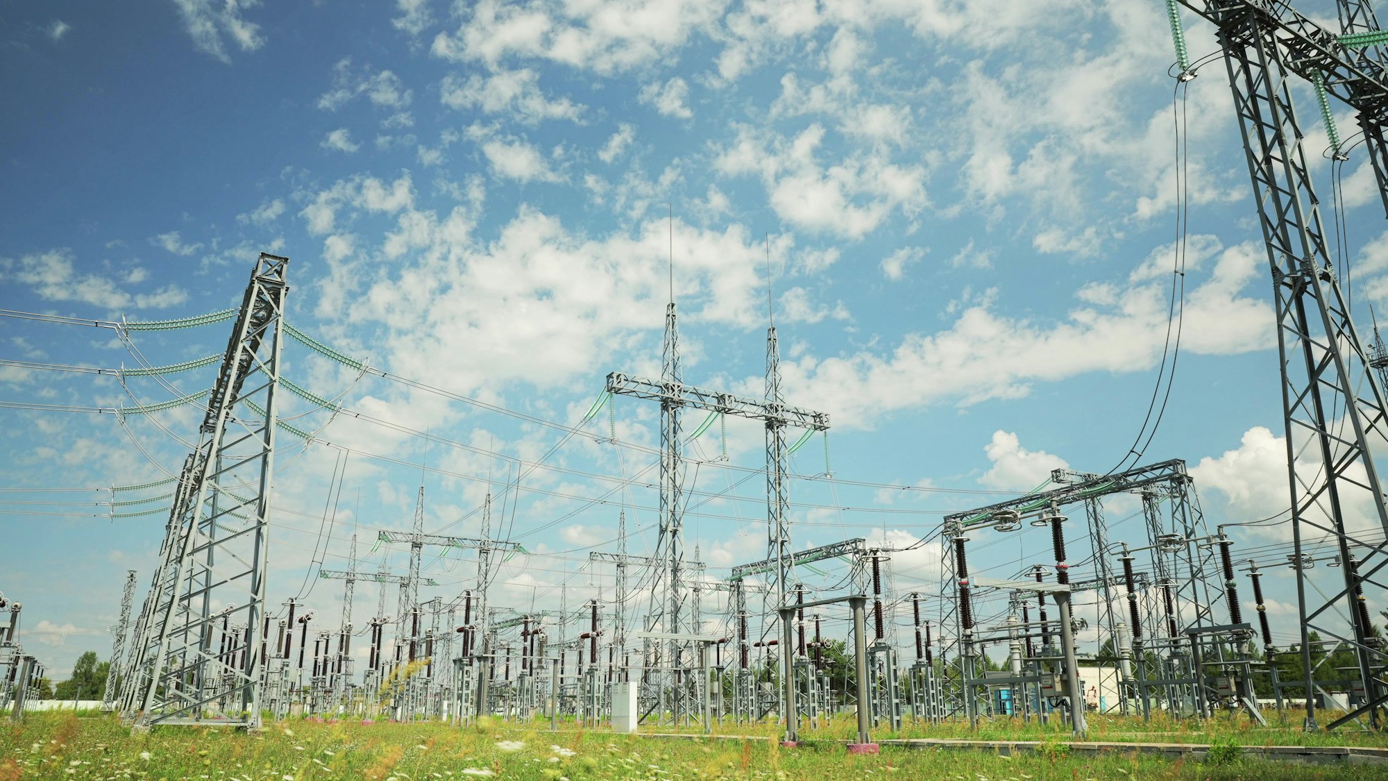 Power Grid Station. Electrical Distribution Station, Transformers, High-voltage Lines In Sunny