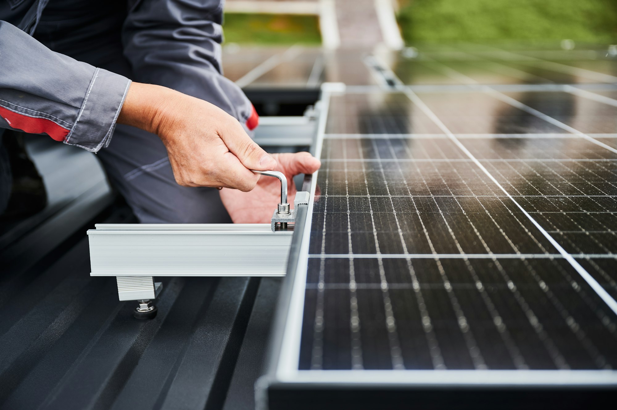 Professional installation of PV system on a roof.